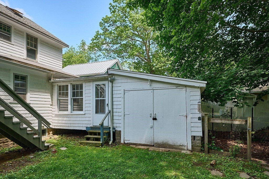 19 Powell Street Northampton, MA 01062 - Photo 30 of 40 a view of a house with a yard