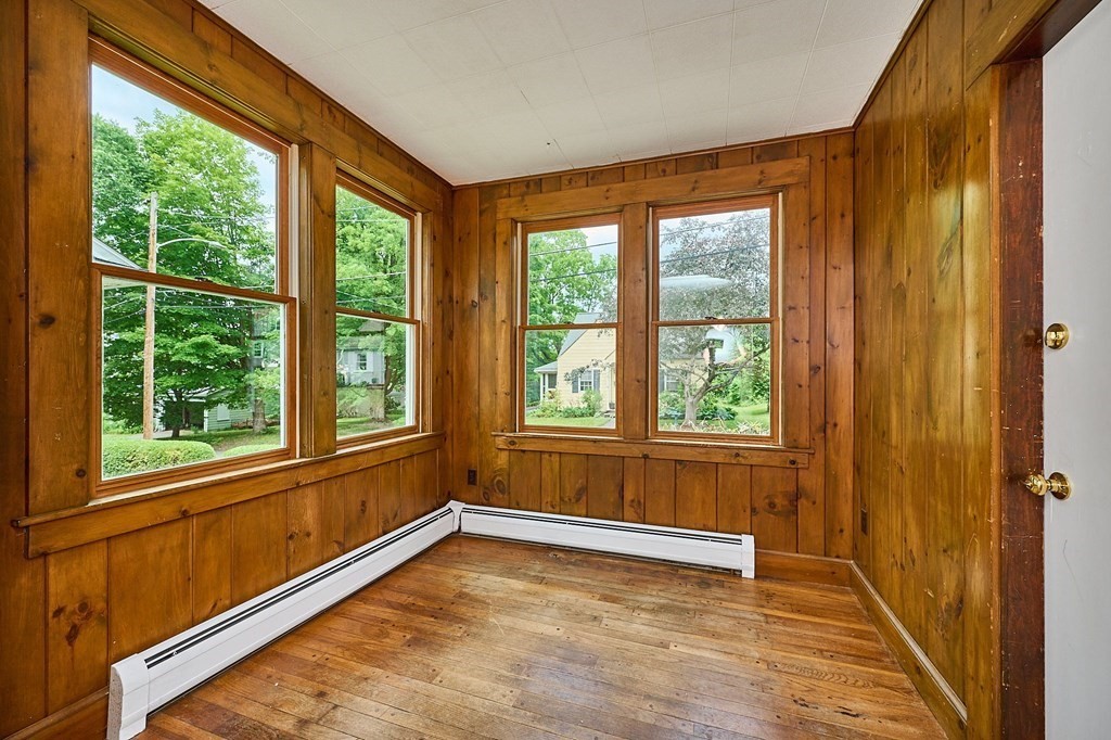 19 Powell Street Northampton, MA 01062 - Photo 4 of 40 a view of an empty room with wooden floor and a window