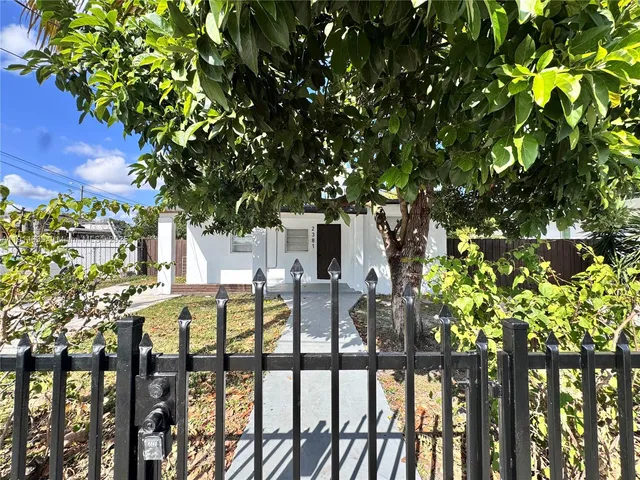 a view of balcony with chairs and wooden fence