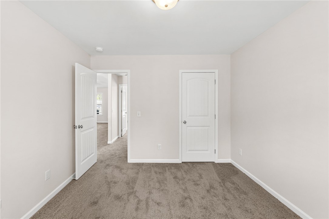 113 Crofton Court Easley, SC 29642 - Photo 15 of 33 This inviting bedroom provides a neutral canvas for your personal style and comfort.