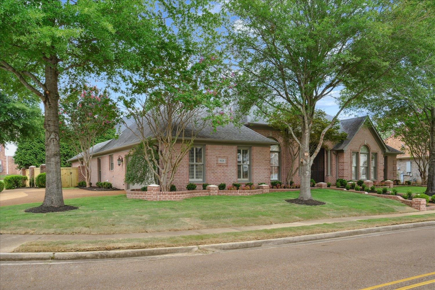 9128 Raspberry Lane Cordova, TN 38016 - Photo 3 of 32 a front view of house with yard and green space
