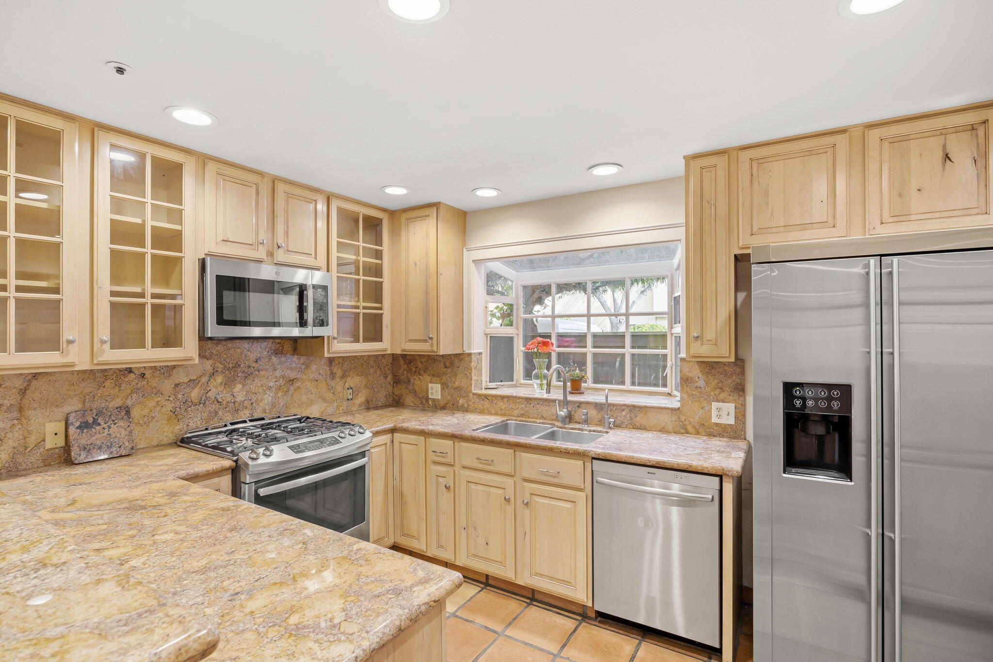 4228 Carpinteria Avenue, Unit 2 Carpinteria, CA 93013 - Photo 14 of 32 a kitchen with stainless steel appliances granite countertop a stove a sink and a refrigerator