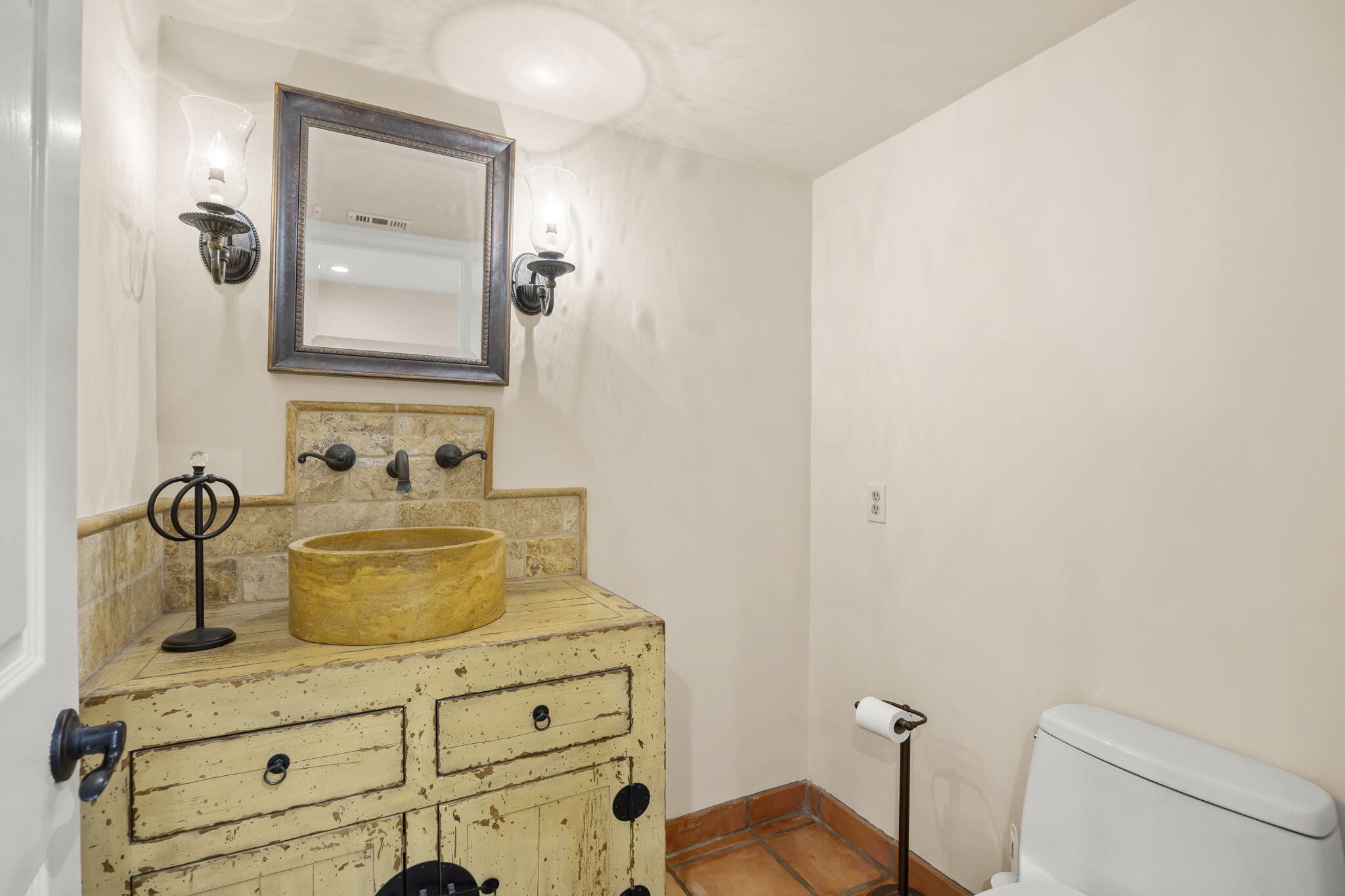 4228 Carpinteria Avenue, Unit 2 Carpinteria, CA 93013 - Photo 17 of 32 a bathroom with a sink a toilet and mirror