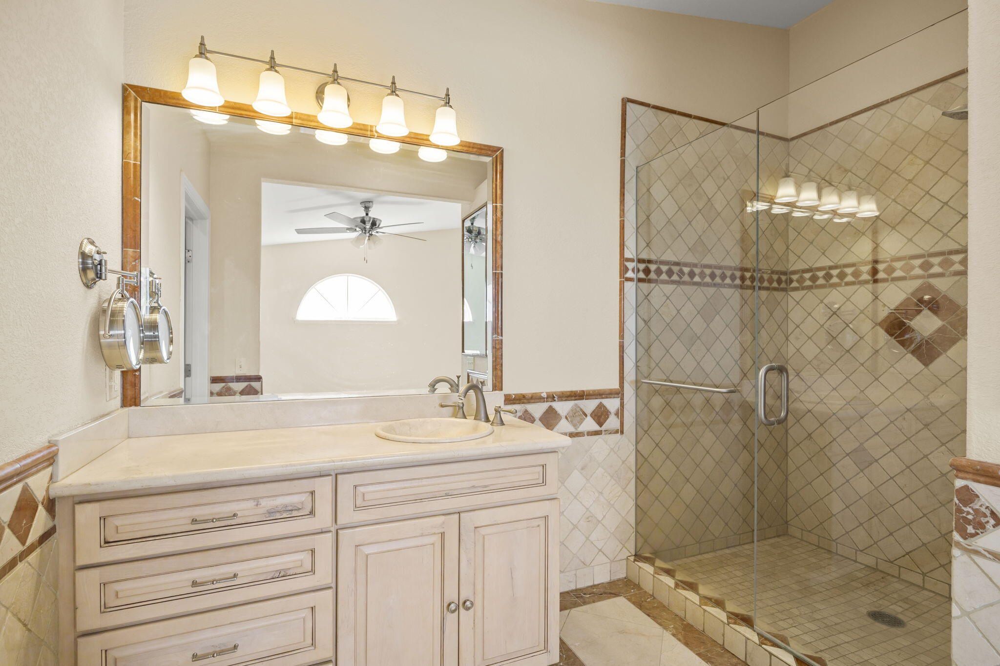 4228 Carpinteria Avenue, Unit 2 Carpinteria, CA 93013 - Photo 26 of 32 a bathroom with a sink and a mirror
