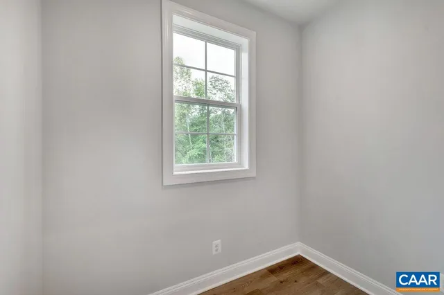 a view of a balcony with wooden floor