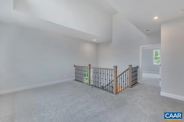 a white bath tub sitting in a bathroom next to a window