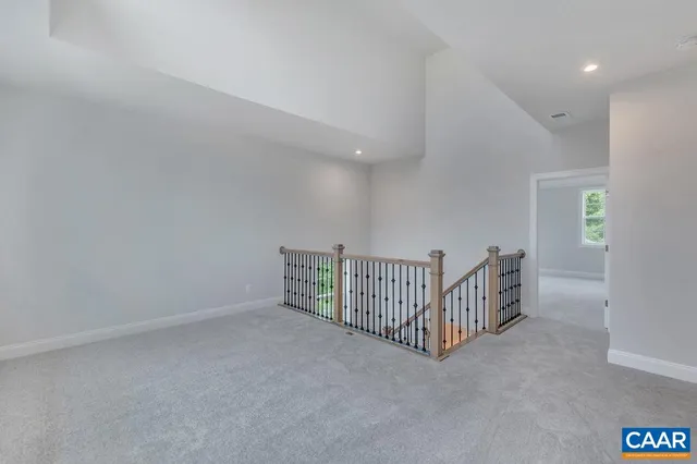 a white bath tub sitting in a bathroom next to a window