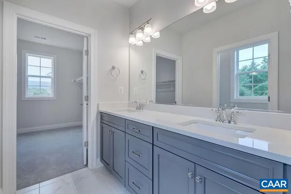 a bathroom with a shower and a glass door