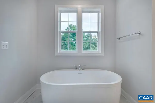 a bathroom with a bathtub and shower