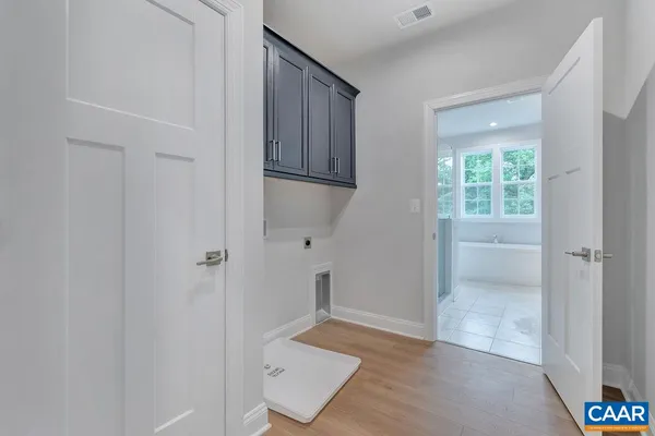 a white bath tub sitting next to a white toilet