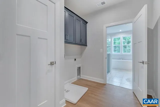 a white bath tub sitting next to a white toilet