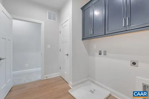 a view of a livingroom with an empty space and a window