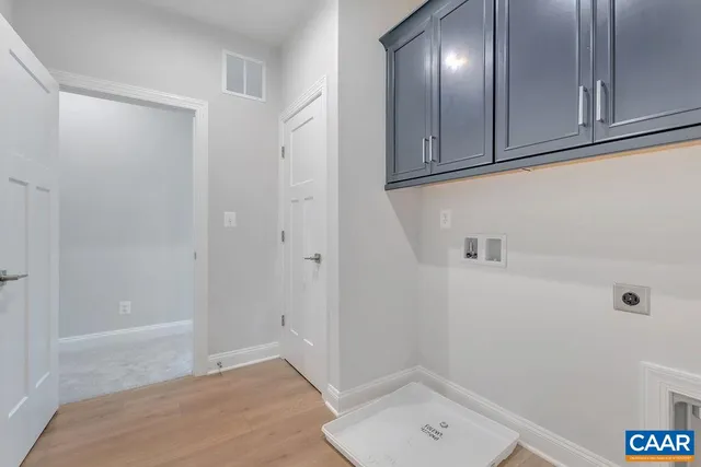 a view of a livingroom with an empty space and a window