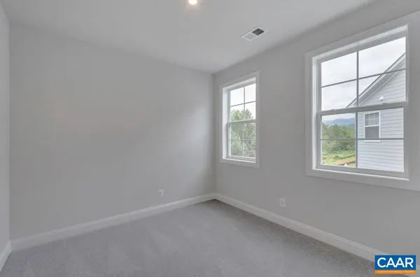 a view of a room that has a window in it