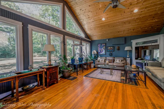 a view of a hallway with windows and stairs