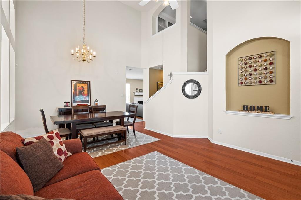 3508 Bratton Ridge Crossing Austin, TX 78728 - Photo 7 of 18 A spacious, open-concept living area with gleaming hardwood floors and soaring ceilings for an airy feel.