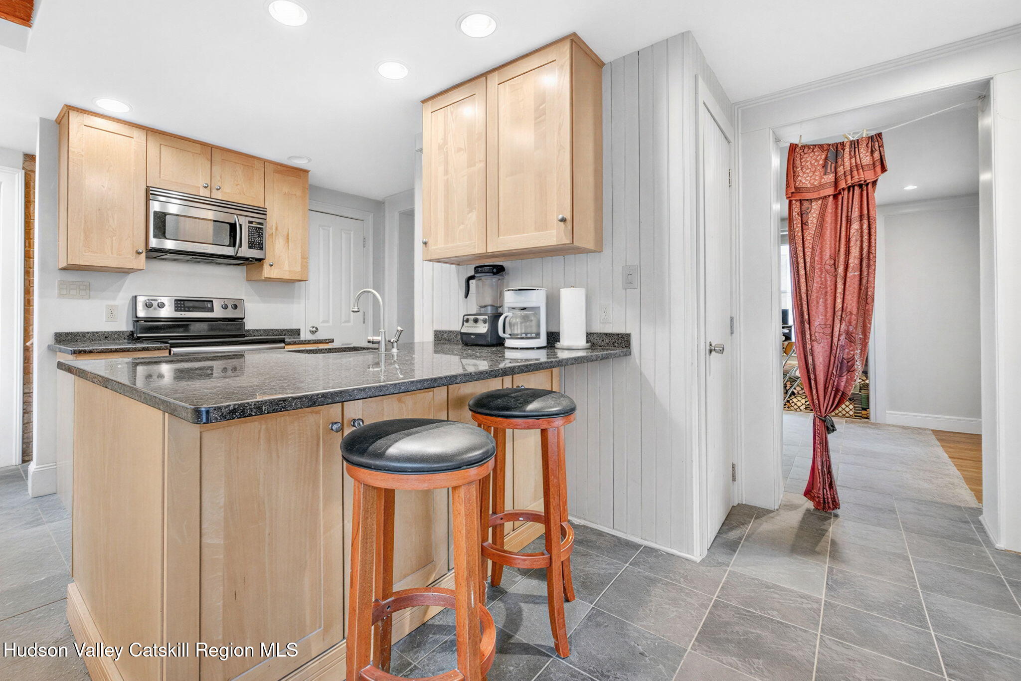 13 South Franklin Street, Unit 3 Athens, NY 12015 - Photo 21 of 55 a kitchen with stainless steel appliances granite countertop a stove a sink and a refrigerator
