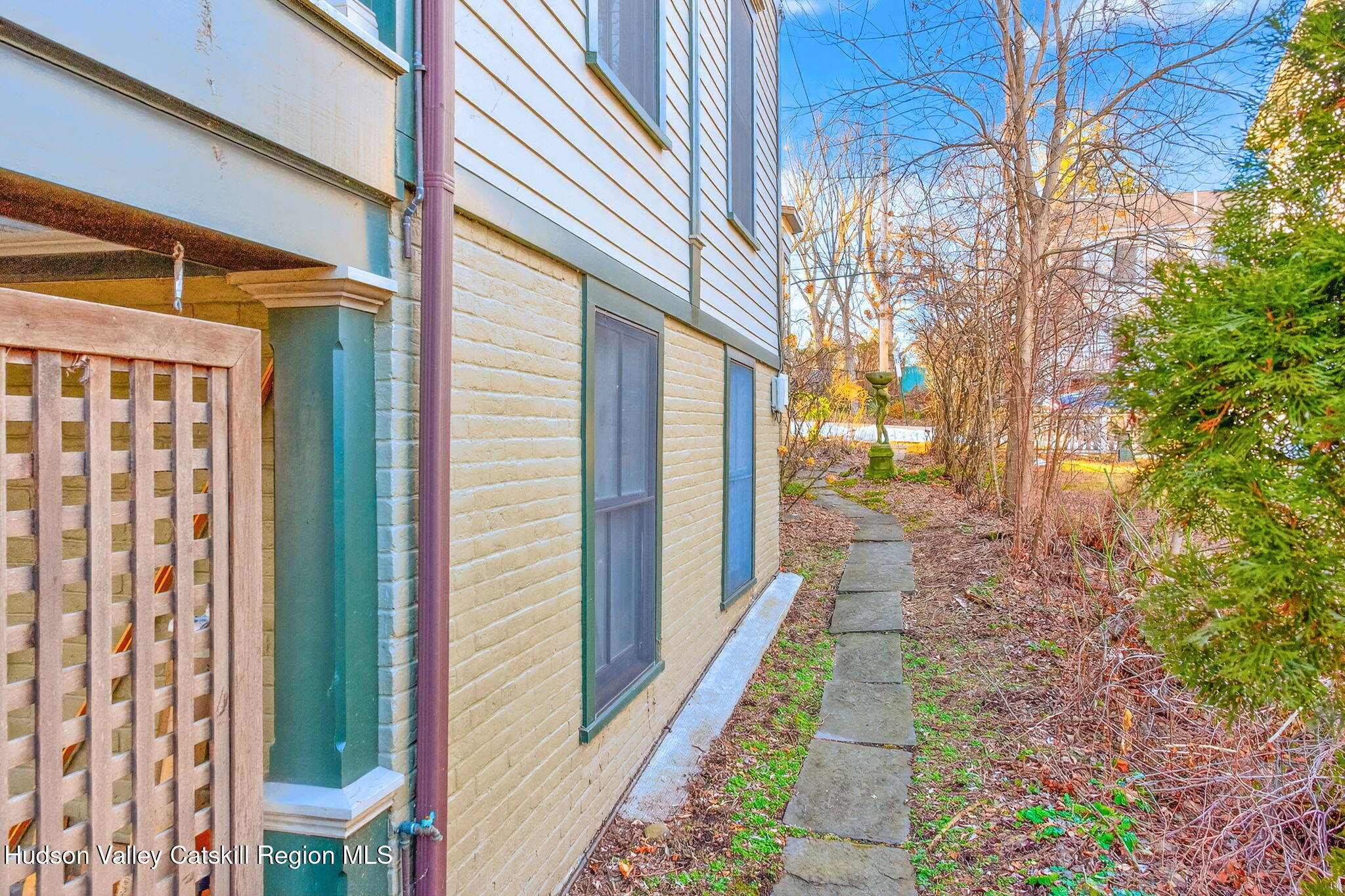 13 South Franklin Street, Unit 3 Athens, NY 12015 - Photo 45 of 55 a view of a pathway of a house with backyard and wooden fence