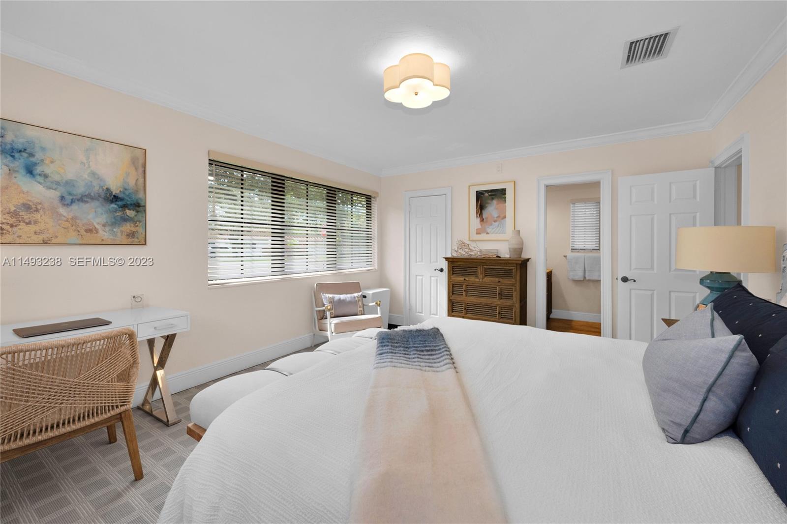 605 Blue Road Coral Gables, FL 33146 - Photo 20 of 34 a bedroom with a bed and furniture