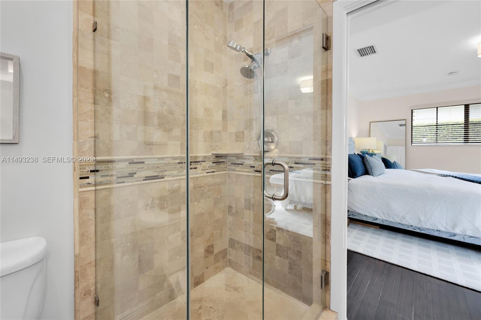 605 Blue Road Coral Gables, FL 33146 - Photo 22 of 34 a bathroom with a tub and shower