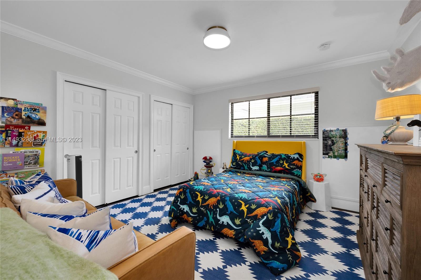 605 Blue Road Coral Gables, FL 33146 - Photo 26 of 34 a bedroom with two beds and a window