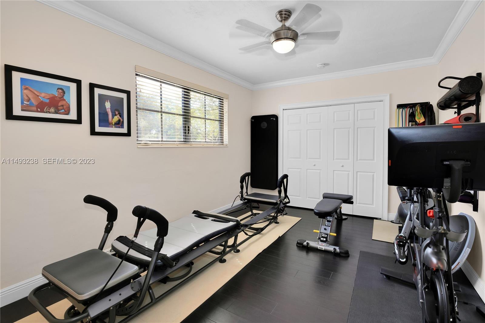 605 Blue Road Coral Gables, FL 33146 - Photo 28 of 34 a view of a workspace with furniture and a window