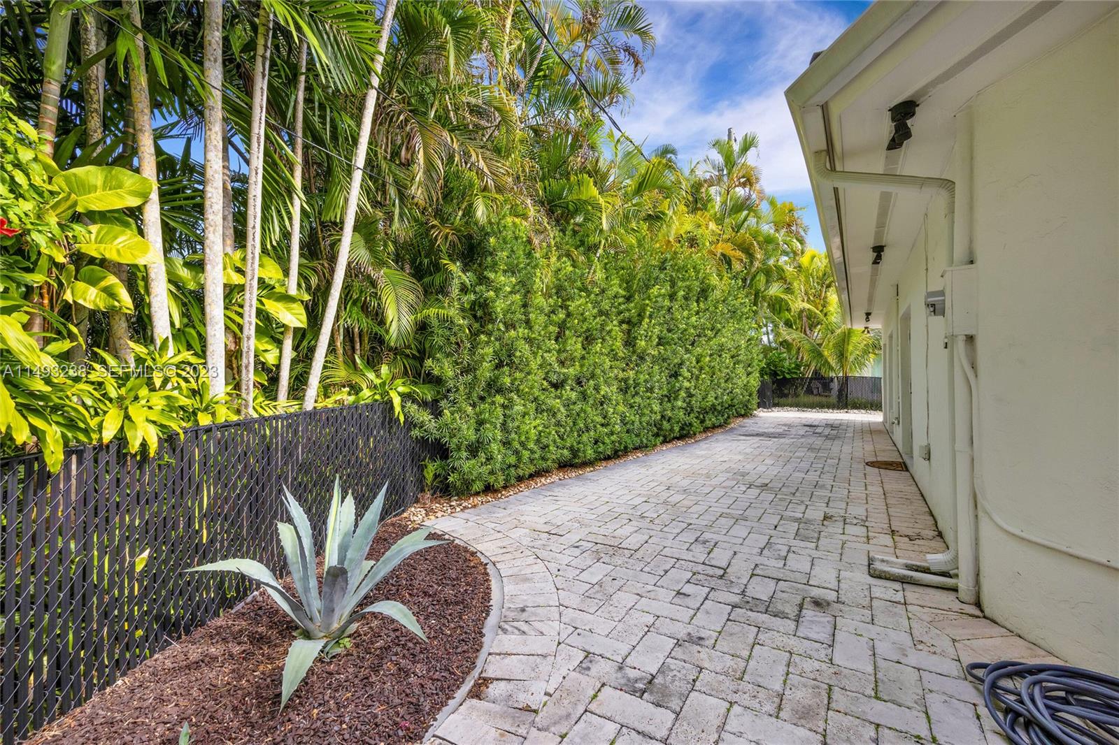 605 Blue Road Coral Gables, FL 33146 - Photo 29 of 34 a view of a back yard of the house
