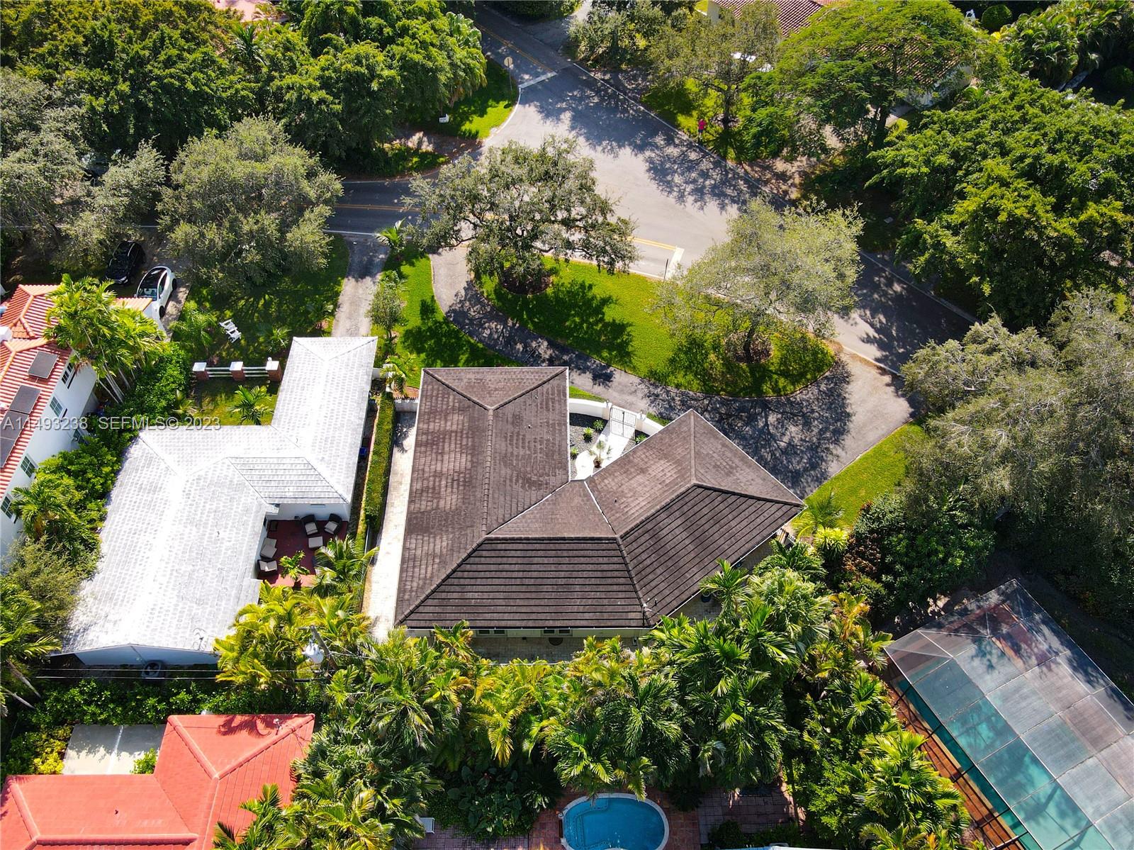 605 Blue Road Coral Gables, FL 33146 - Photo 31 of 34 an aerial view of a house with a garden
