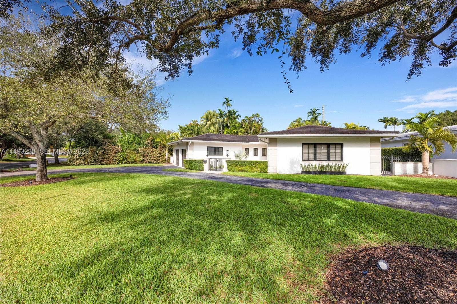605 Blue Road Coral Gables, FL 33146 - Photo 4 of 34 a view of a house with a yard