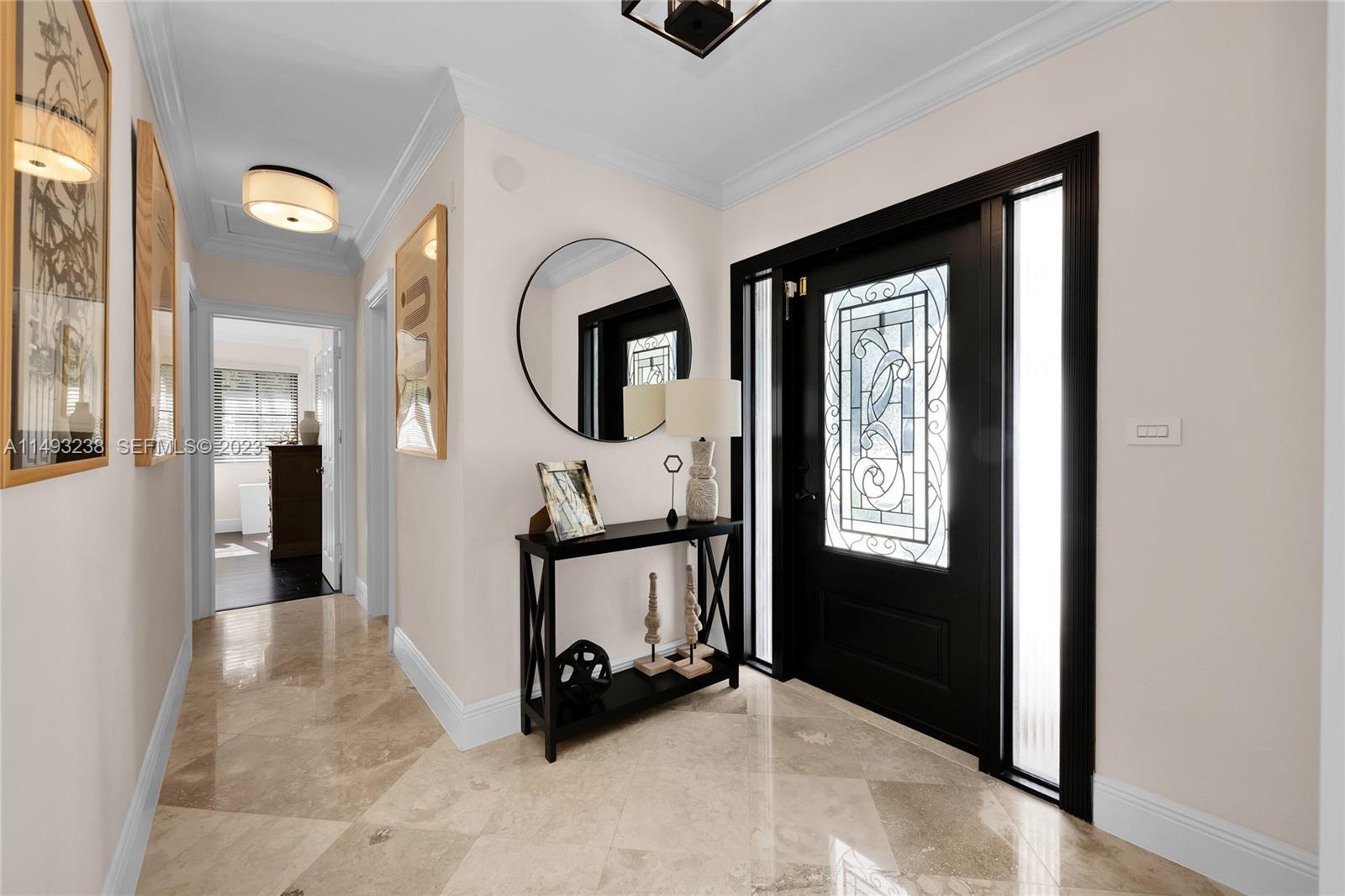 605 Blue Road Coral Gables, FL 33146 - Photo 7 of 34 a view of a livingroom with furniture and windows