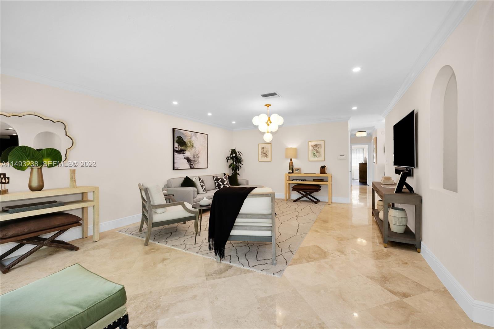 605 Blue Road Coral Gables, FL 33146 - Photo 10 of 34 a living room with furniture and a flat screen tv