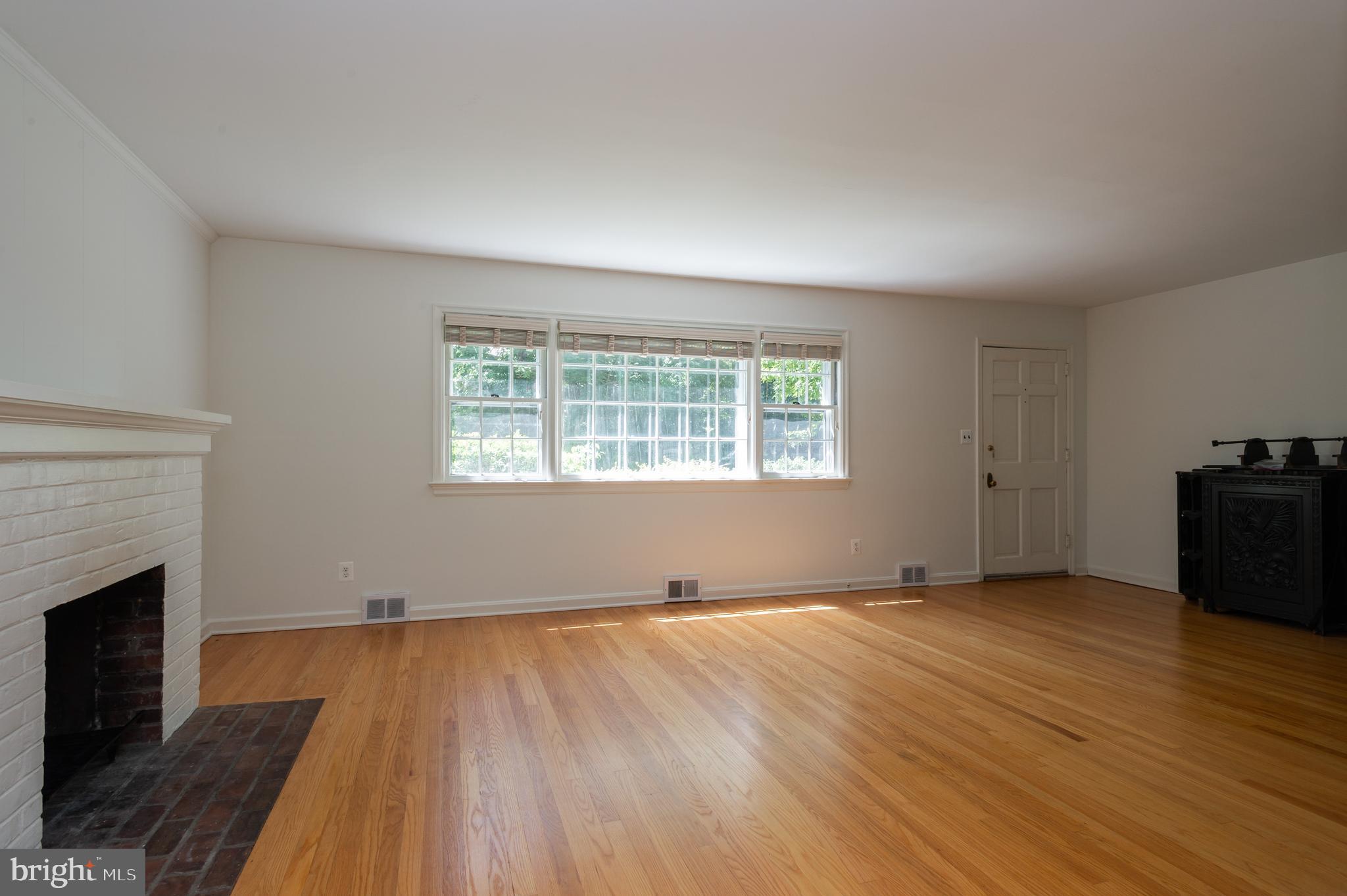 29 Wilson Road Princeton, NJ 08540 - Photo 7 of 25 Living Room with brick fireplace and wood floors
