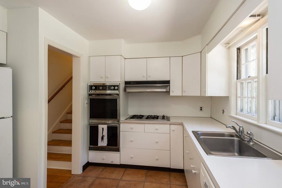 29 Wilson Road Princeton, NJ 08540 - Photo 9 of 25 Kitchen with ceramic tiled floors and view of back