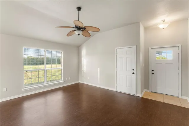 a view of an empty room with a window