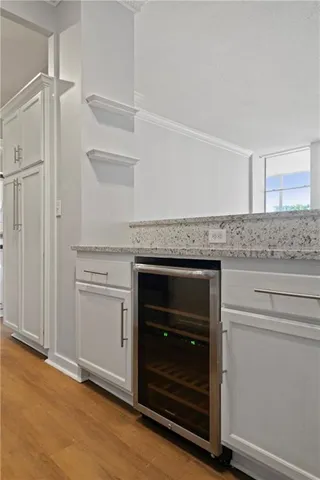 a kitchen with granite countertop cabinets and oven