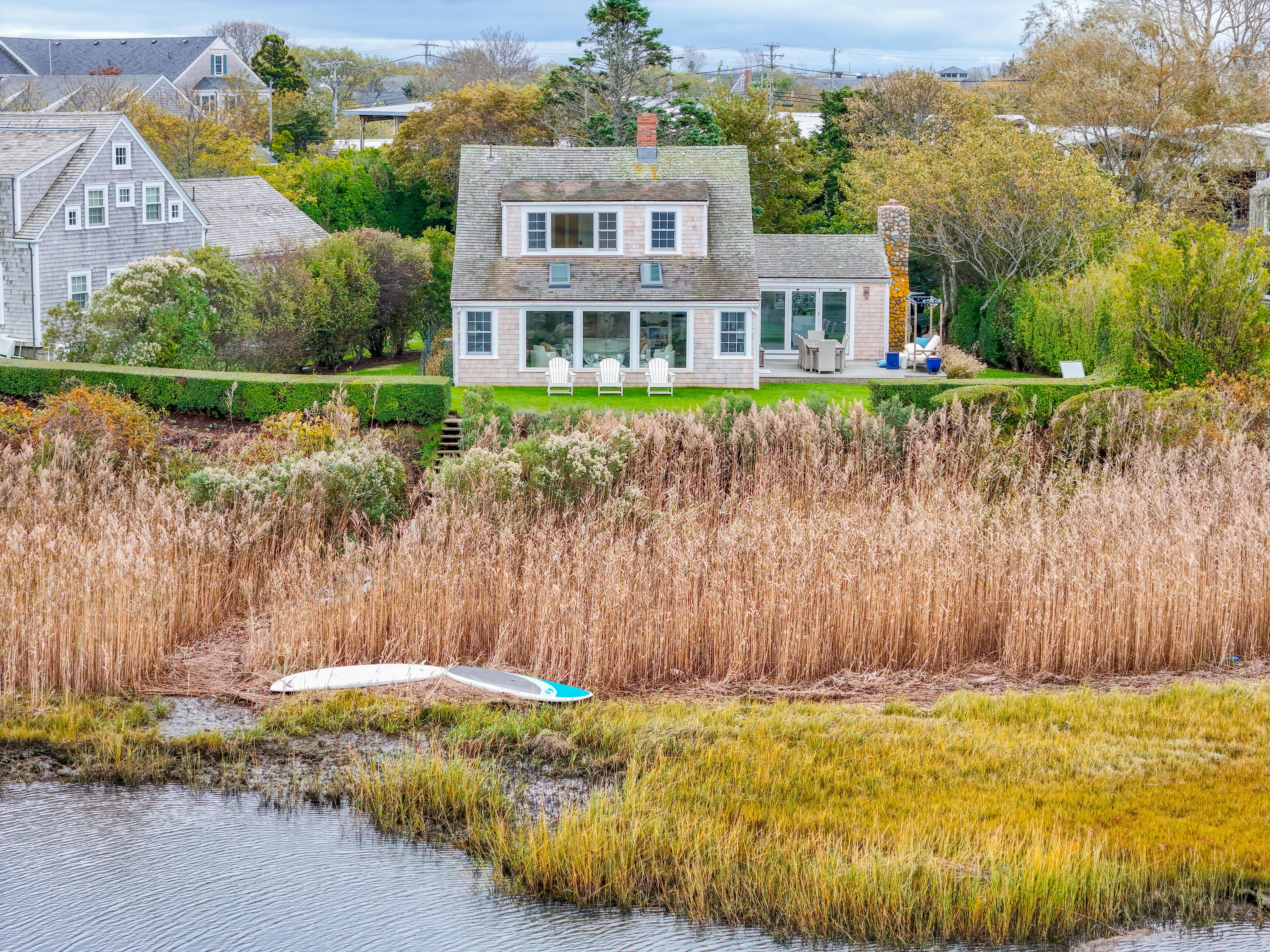 6 Harbor Terrace Nantucket, MA 02554 - Photo 3 of 18 a front view of a house with a garden