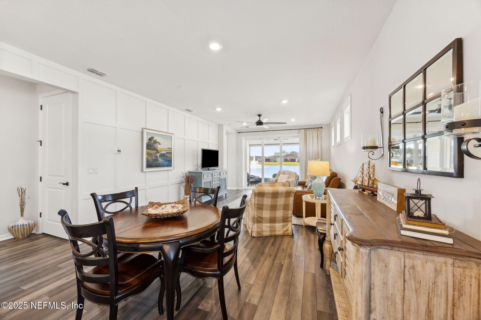 671 Jubilee Circle Yulee, FL 32097 - Photo 11 of 126 a view of a dining room with furniture and a large window