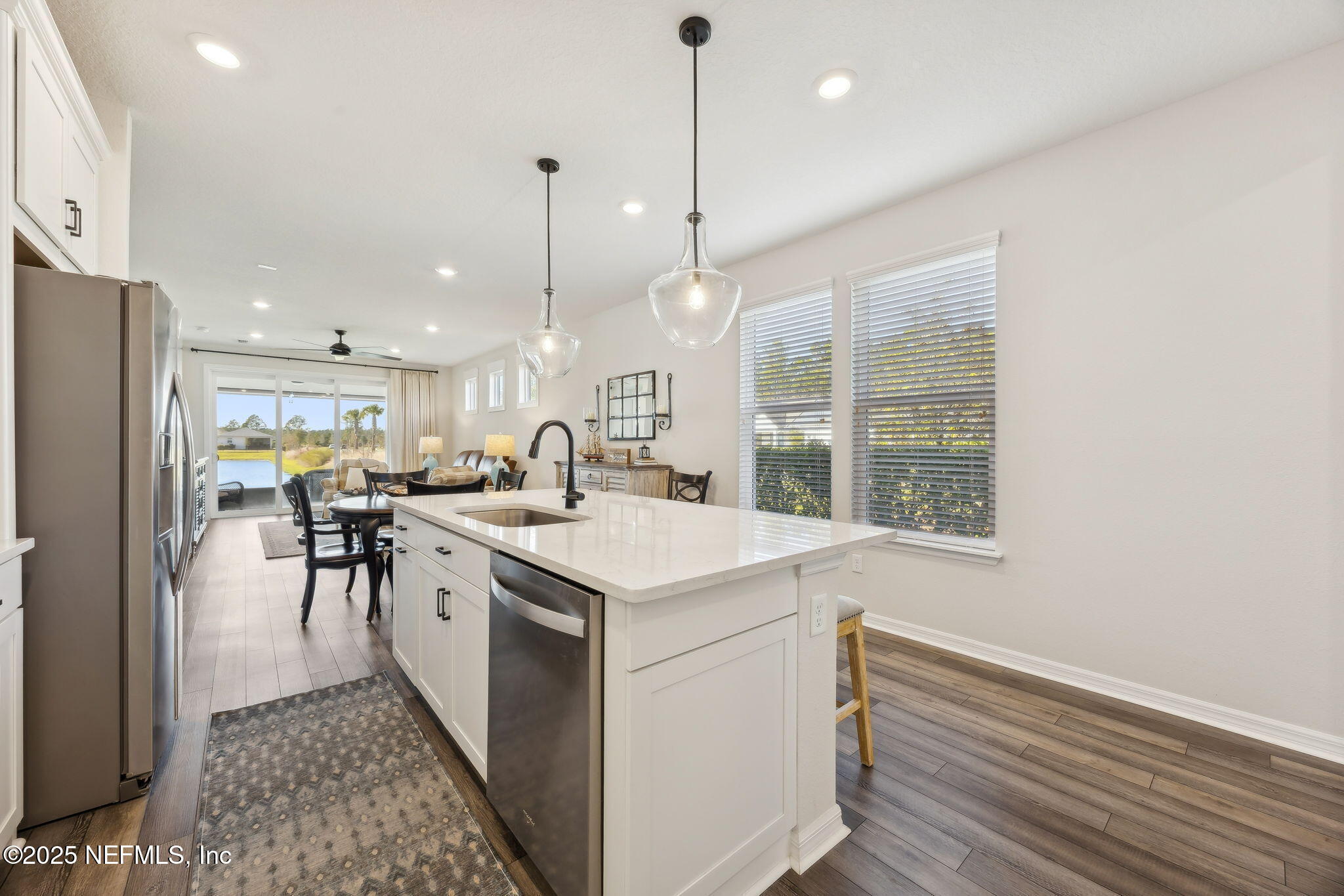 671 Jubilee Circle Yulee, FL 32097 - Photo 17 of 126 a kitchen with a sink a table and chairs