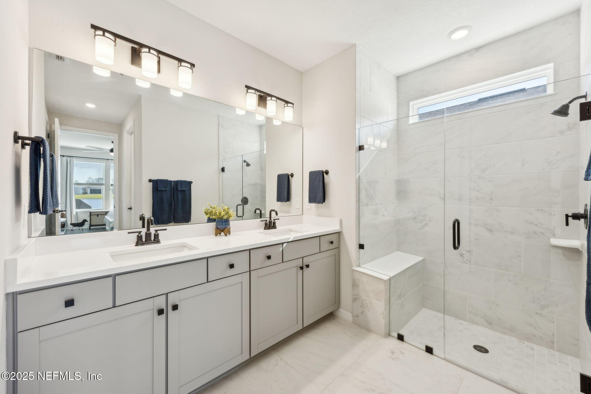 671 Jubilee Circle Yulee, FL 32097 - Photo 22 of 126 a spacious bathroom with a shower sink mirror and