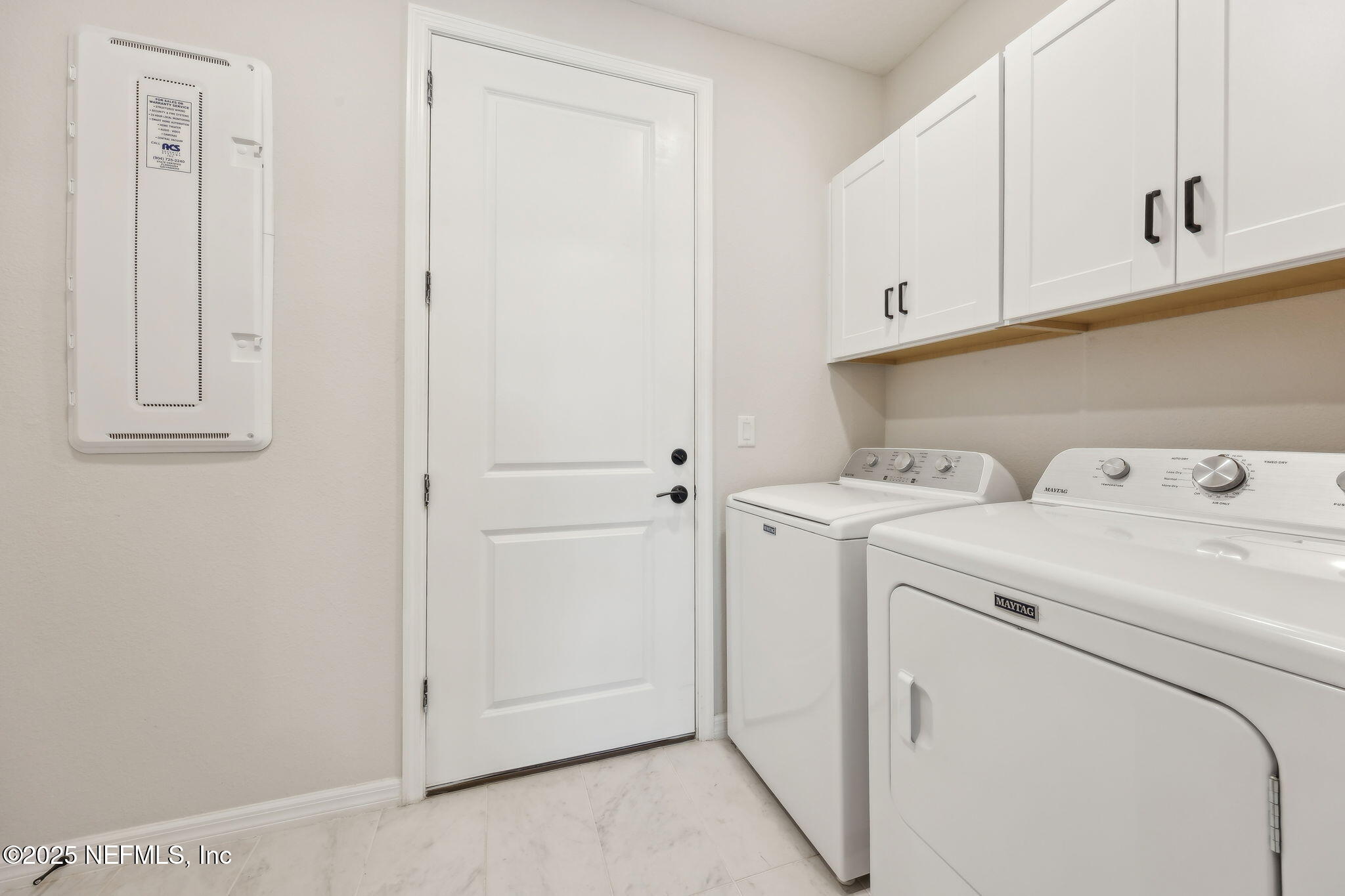 671 Jubilee Circle Yulee, FL 32097 - Photo 29 of 126 a view of storage and utility room with washer and dryer