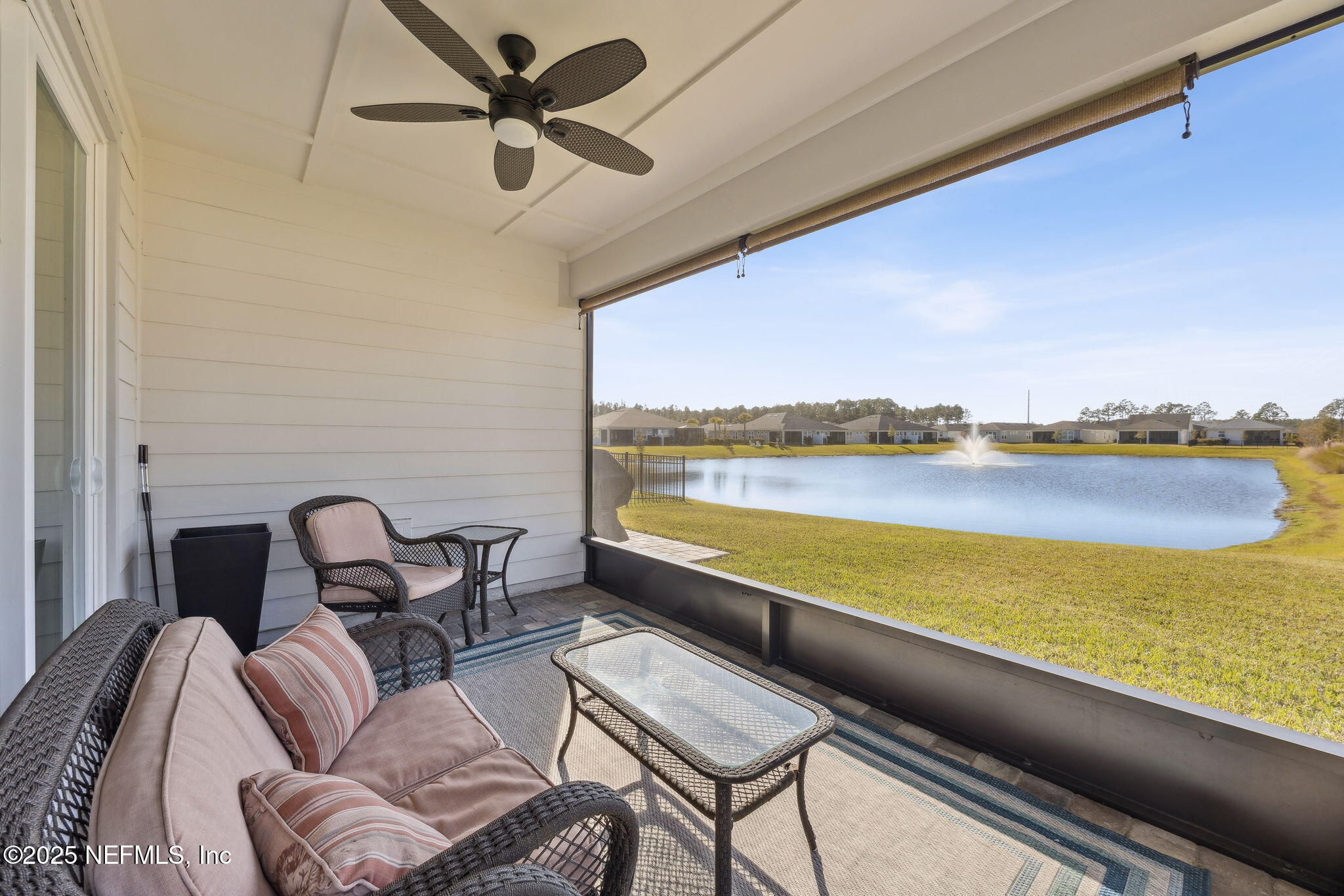 671 Jubilee Circle Yulee, FL 32097 - Photo 32 of 126 a balcony with furniture and a ocean view