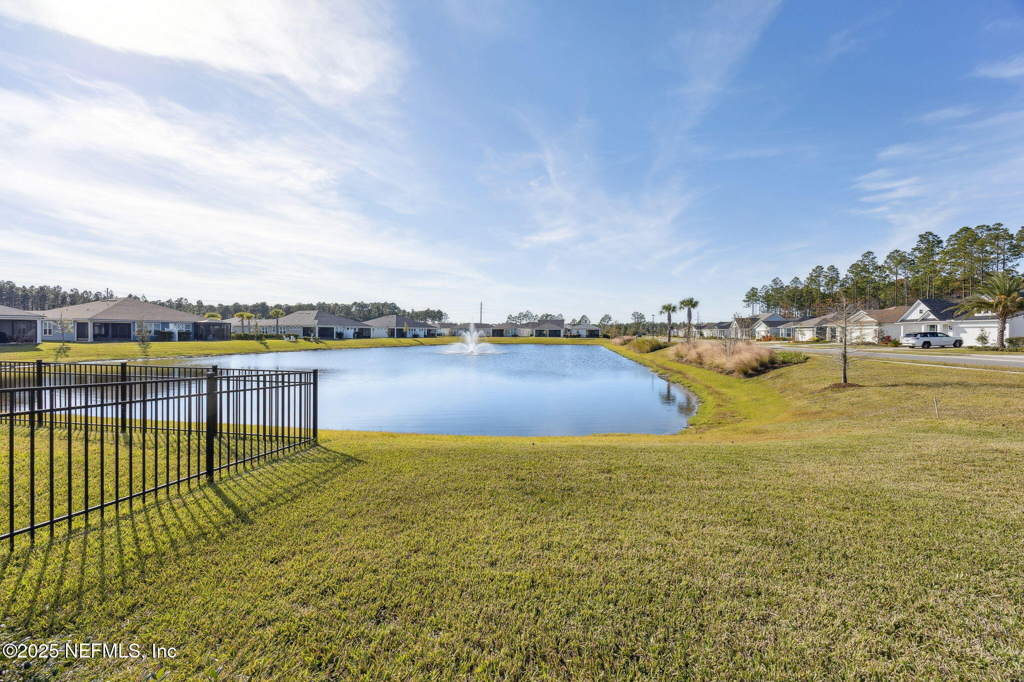 671 Jubilee Circle Yulee, FL 32097 - Photo 41 of 126 a view of a swimming pool and lake