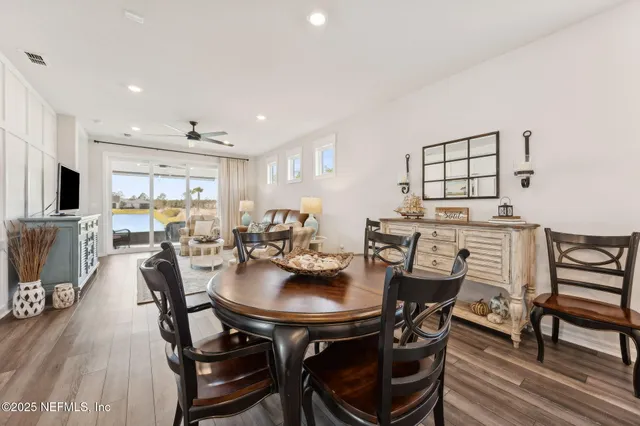 a bedroom with a bed window and a flat screen tv