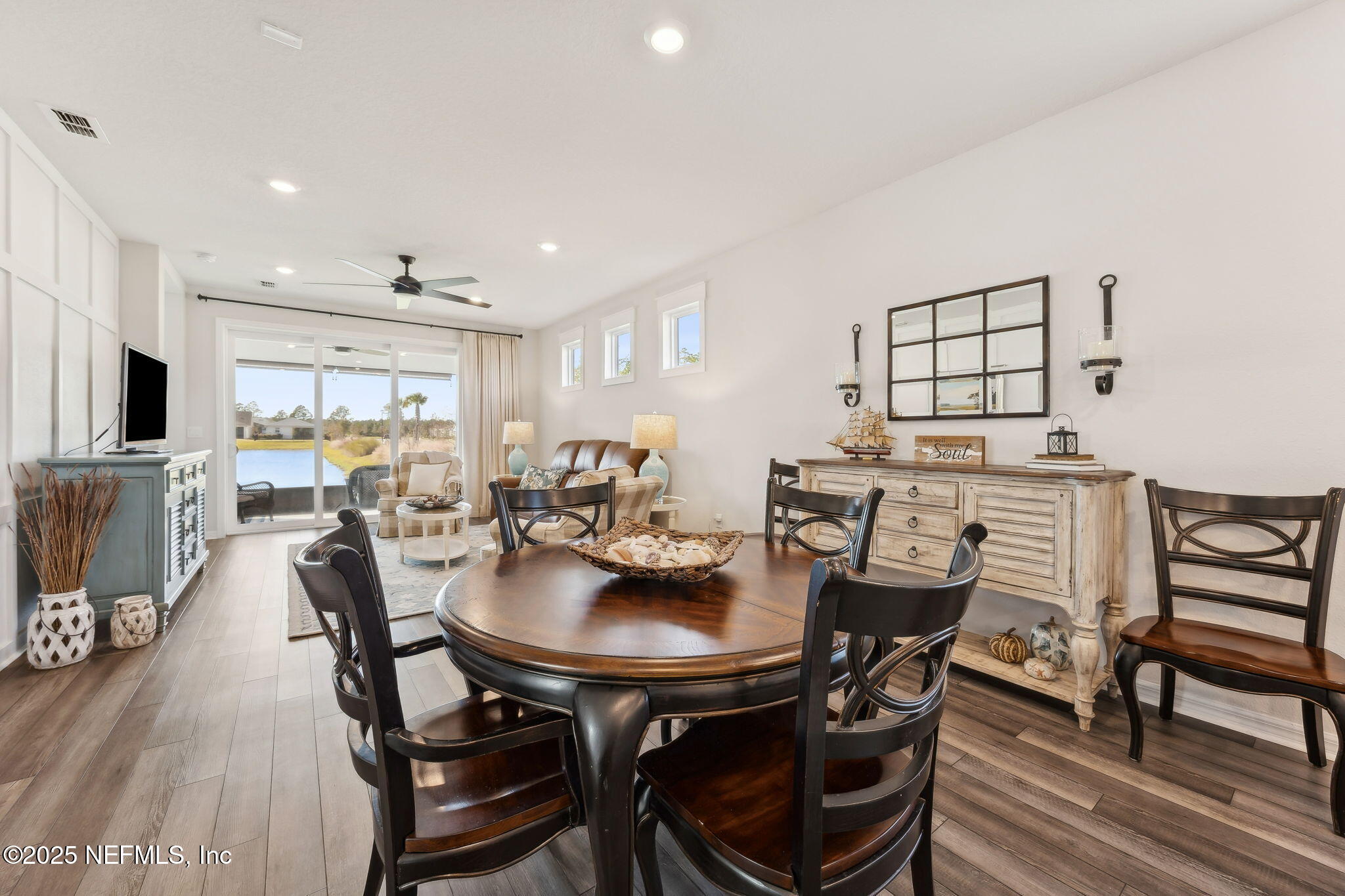 671 Jubilee Circle Yulee, FL 32097 - Photo 10 of 126 a view of a dining room with furniture and wooden floor