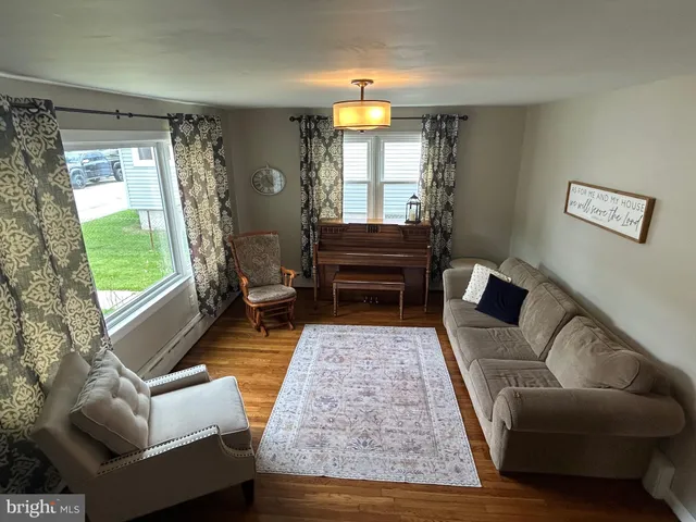 a living room with furniture and a rug