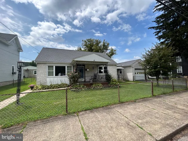 a view of a house and a yard