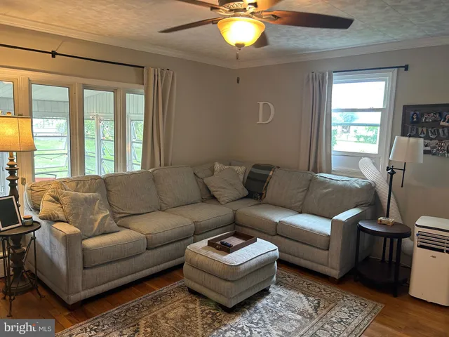 a living room with furniture and a rug