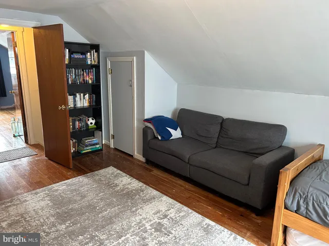 a living room with furniture and floor to ceiling windows