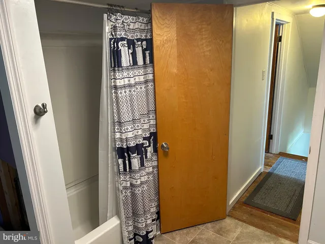 a utility room with washing machine