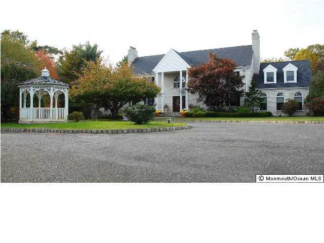 49 Phalanx Road Colts Neck, NJ 07722 - Photo 2 of 3 a black and white photo of a house